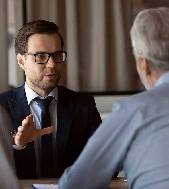  financial advisor talking consulting retired couple