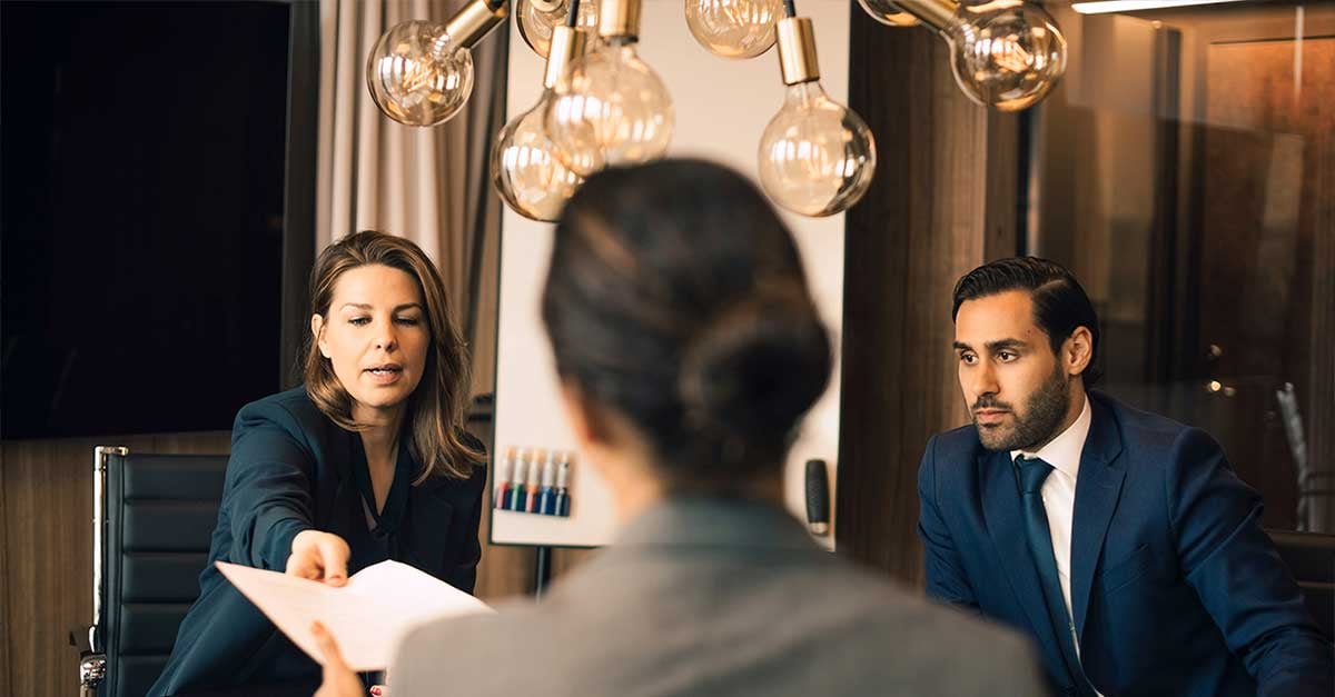 image depicting a female lawyer with colleagues giving document to advisor in office