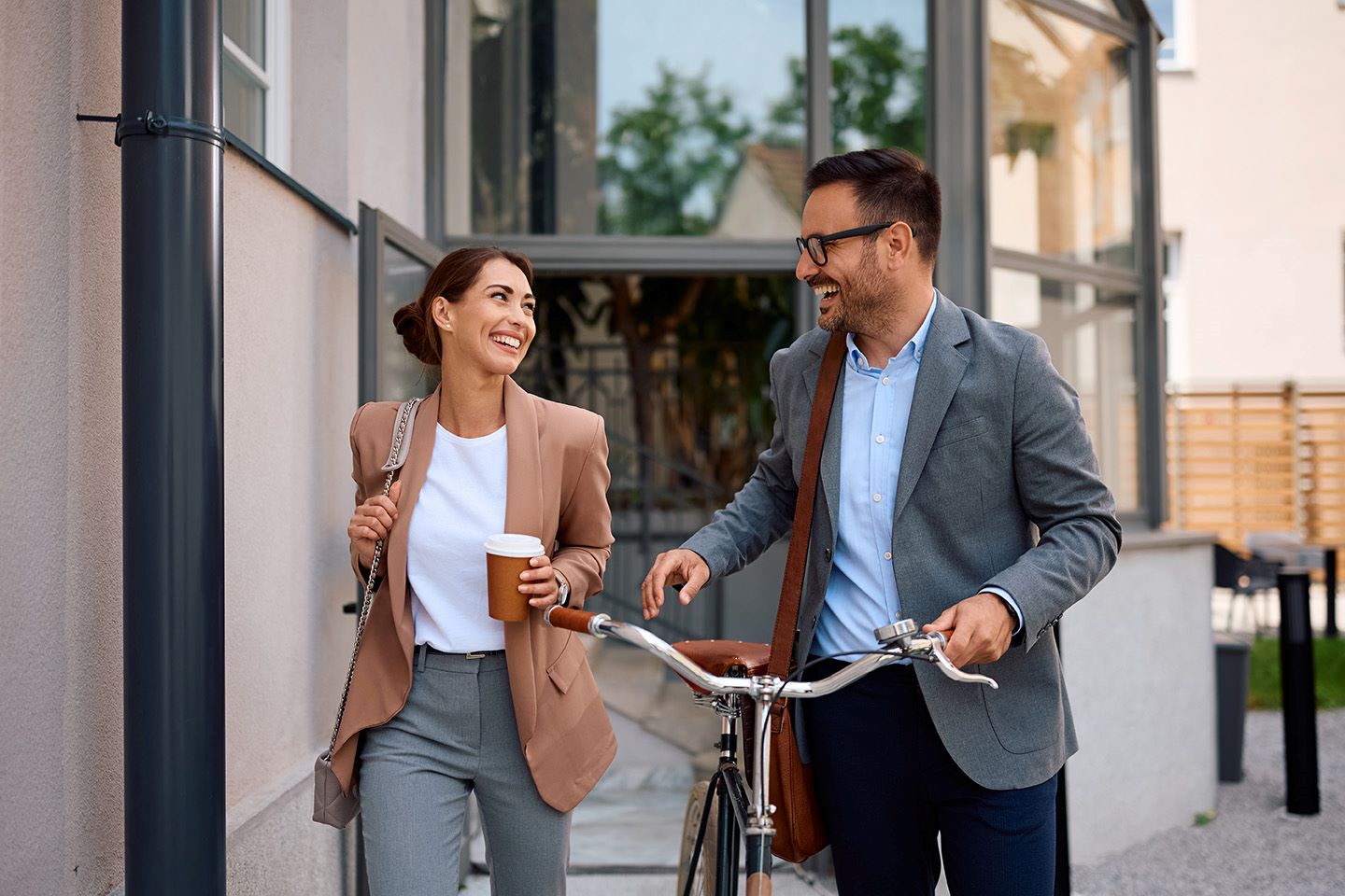 colleagues-leaving-office-with-bicycle