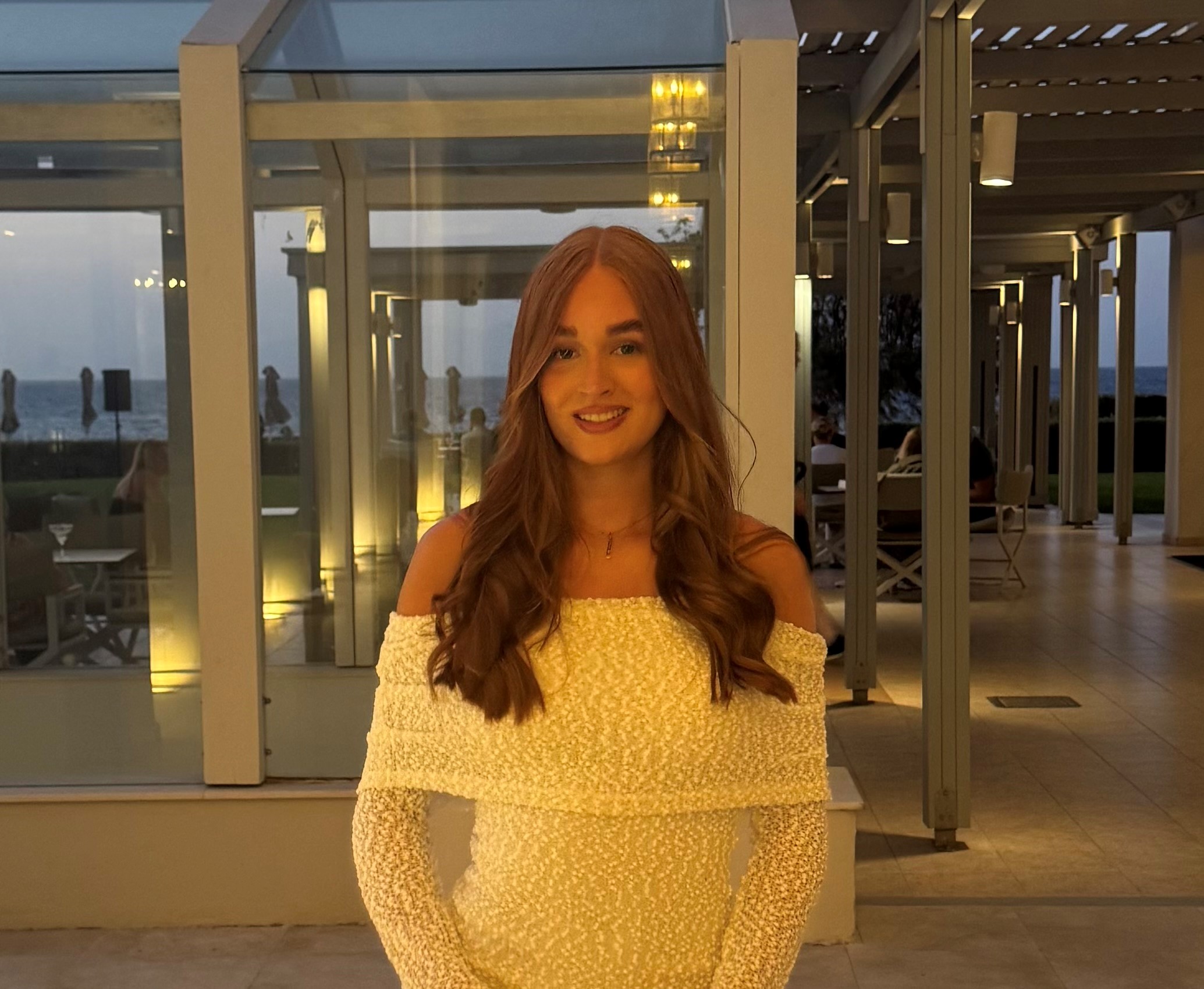 Maisie stood in front of a building