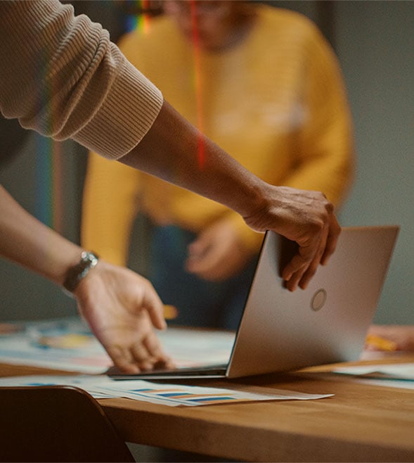 Close Up of Diverse Team Having Conversation in Meeting Room
