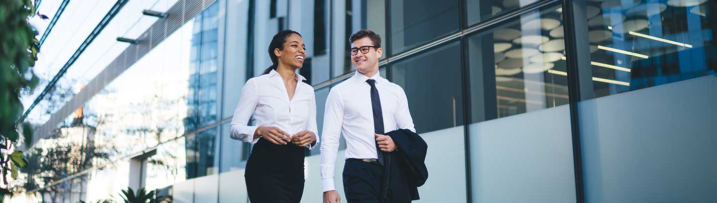 Two colleagues walking together talking