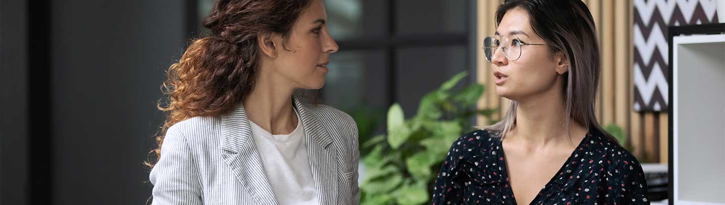 Photograph of two women talking