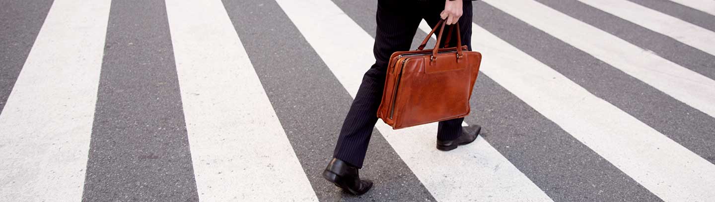 Image depicting a business man on zebra crossing