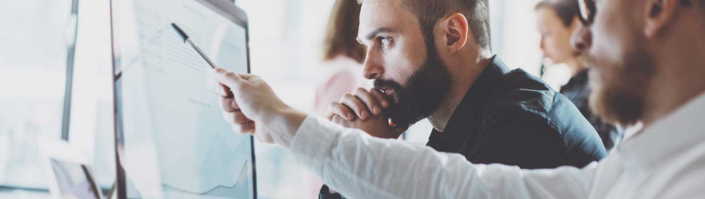 image depicting two colleagues on a computer