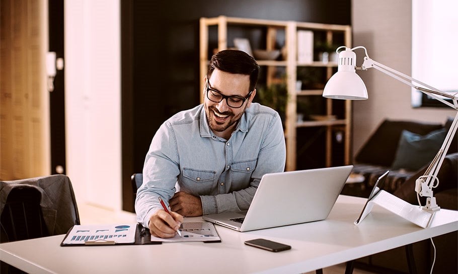 image depicting a man working from home