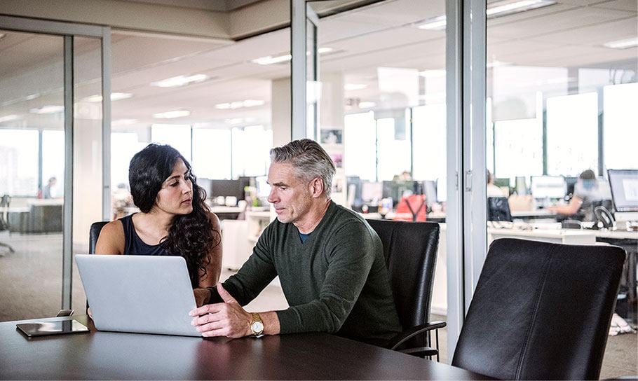  Two business people discussing a project.