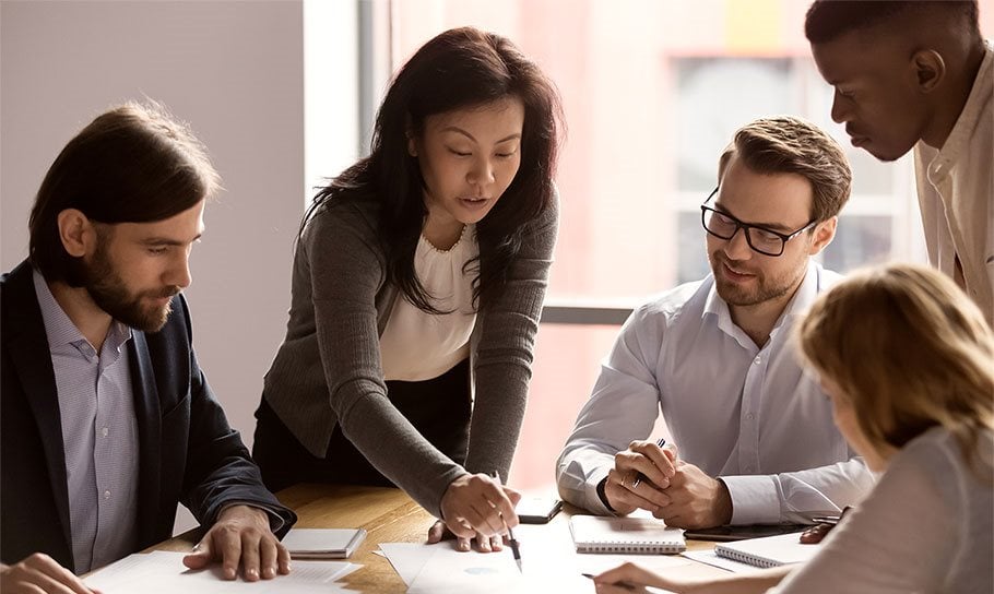 a photograph of a team making a plan