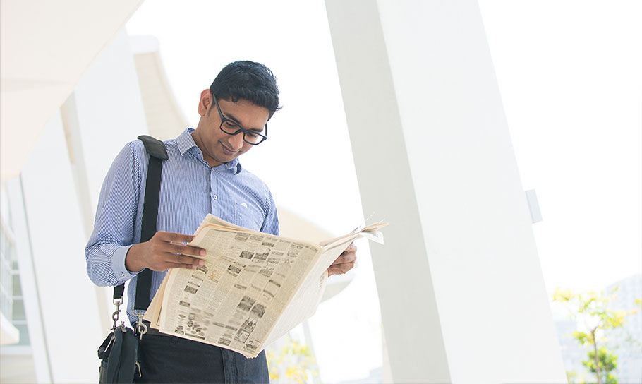 a man reading a newspaper