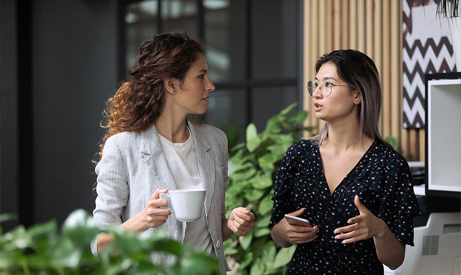 Photograph of two women talking