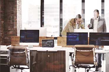 image depicting employees working in the office 